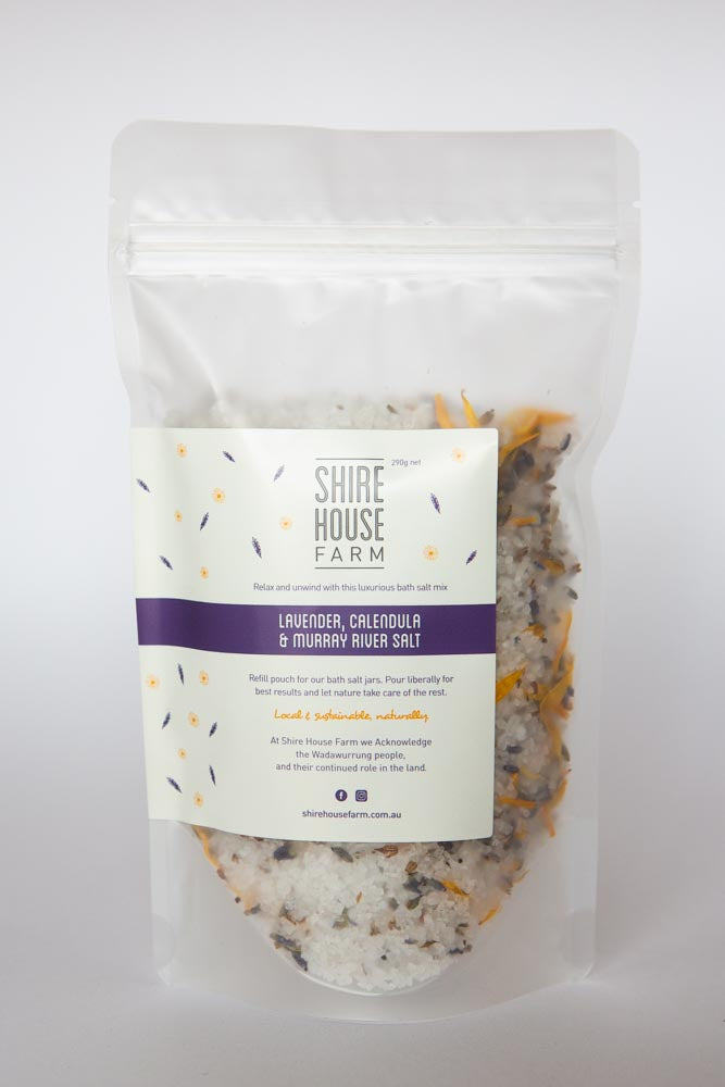 A clear plastic pouch with bath salt, on a white background