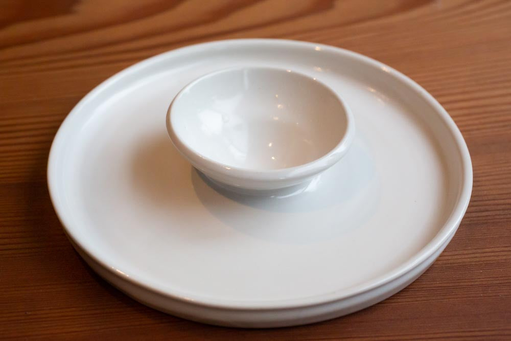 A dukkah dish on a wooden surface