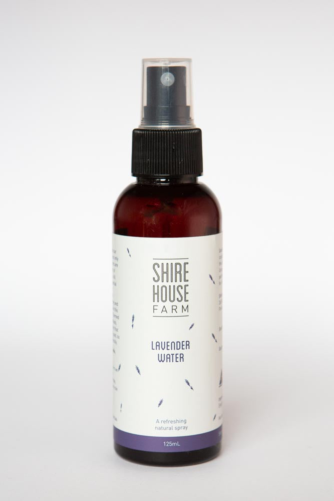 A bottle of lavender spray on a white background