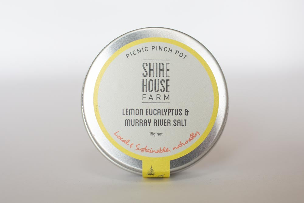 The lid of a tin of salt, on a white background