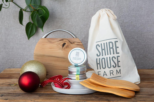 Cheese board, ceramic dish and wood salad hands, with three salt pots. A cotton pouch and xmas decorations