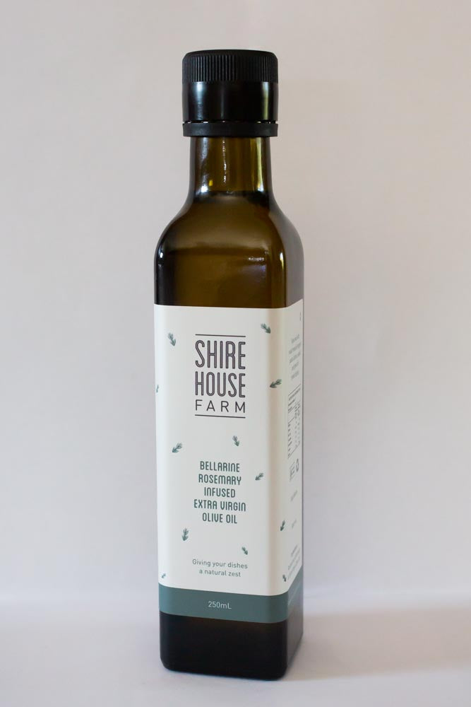 A bottle of olive oil on a white background