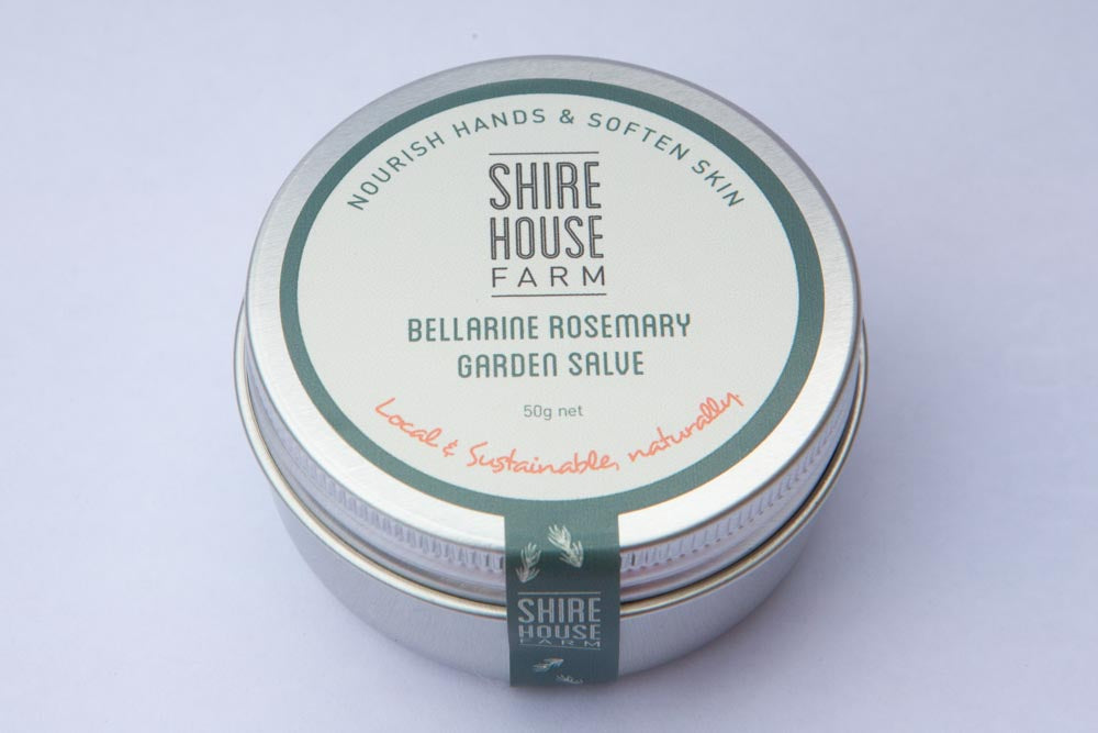 A tin of hand balm on a white background